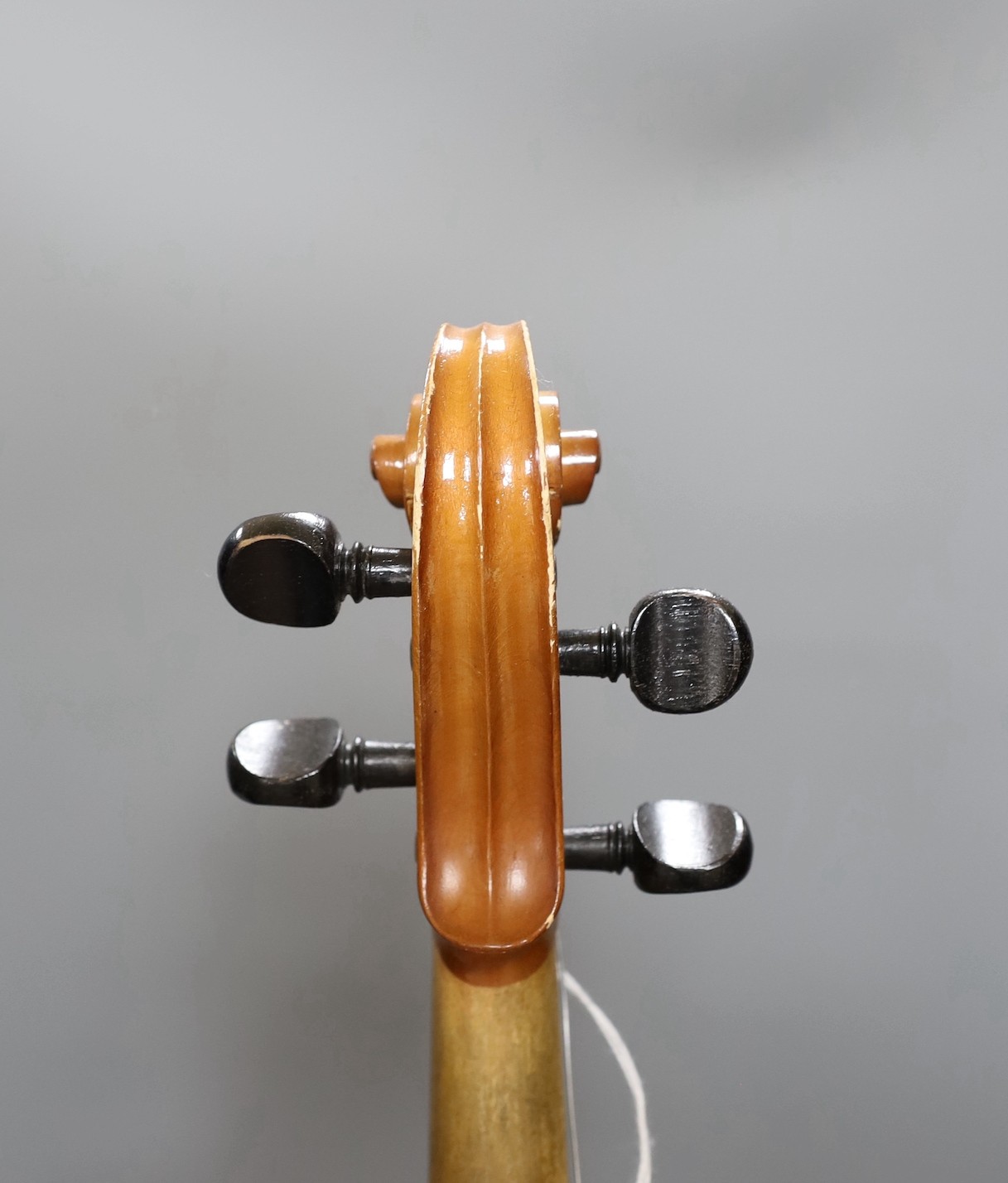 A cased 20th century Romanian violin, back measures 35.5cm excl button